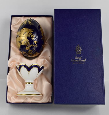 Lot 159 - A Royal Crown Derby Faberge egg in cobalt blue...