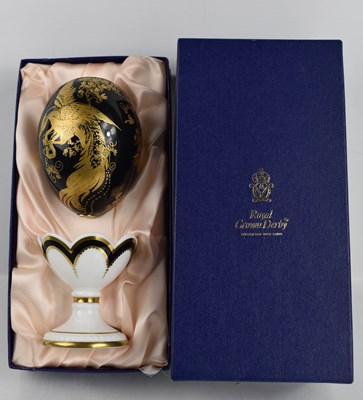 Lot 160 - A Royal Crown Derby Faberge egg , with leaflet...