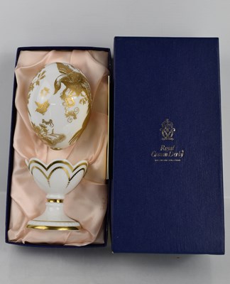 Lot 161 - A Faberge porcelain egg on stand, in white...