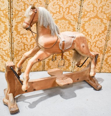 Lot 329 - A 20th century carved rocking horse on a...