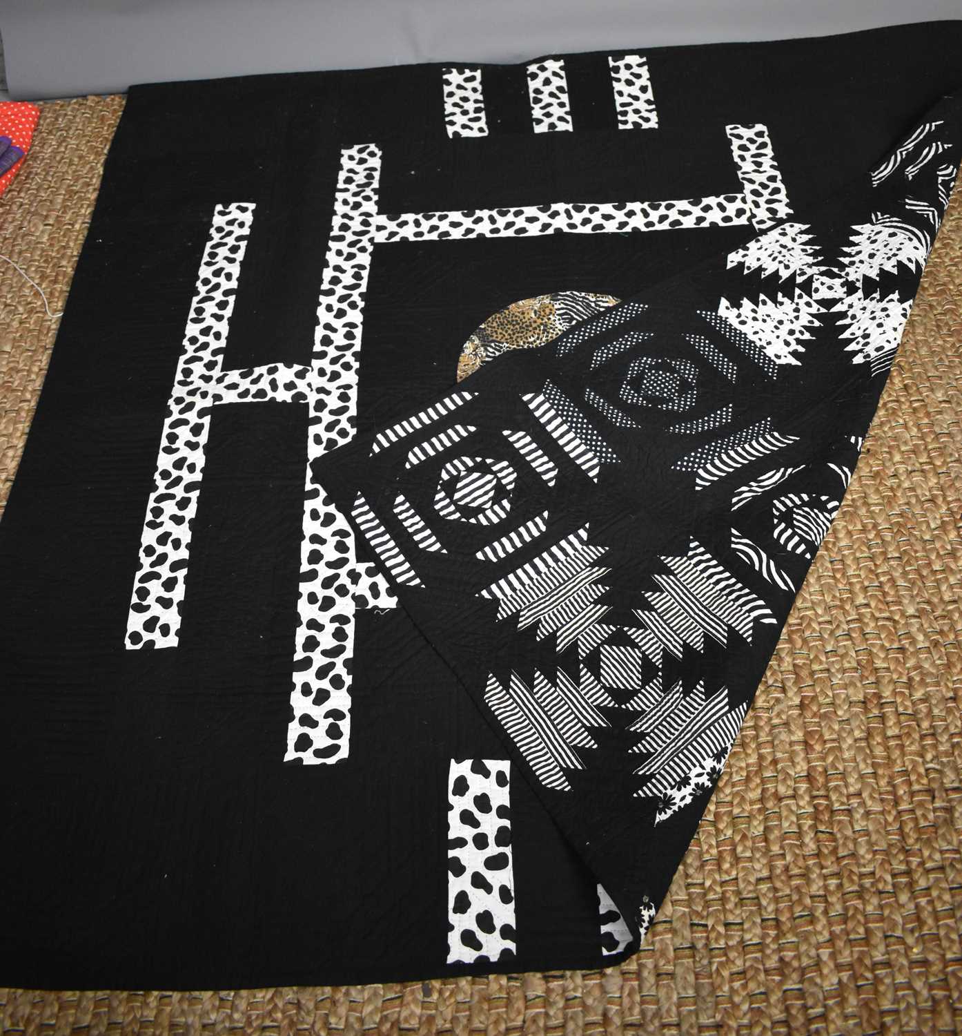 Lot 325 - A late 20th century quilt, hand sewn with a...