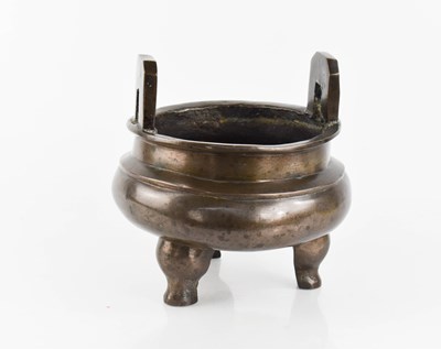 Lot 304 - An early bronze footed vessel, with two large...