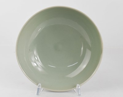 Lot 288 - A Chinese green celadon glazed bowl, with...