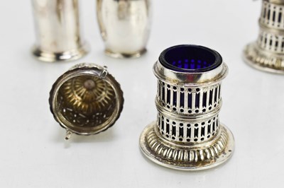 Lot 300 - A pair of Georgian silver pepper pots of...