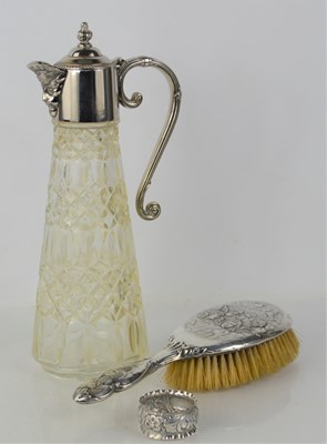 Lot 293 - A silver backed hairbrush, decorated with...