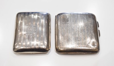 Lot 299 - A silver curved cigarette case with engine...