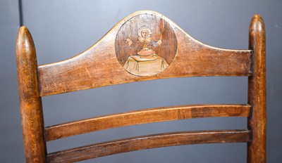 Lot 559 - An Arts and Crafts child's rocking chair, with...