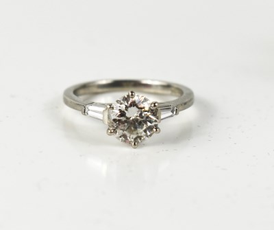 Lot 77 - A platinum diamond solitaire ring with...