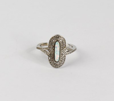 Lot 61 - An Art Deco style silver ring, the opal style...