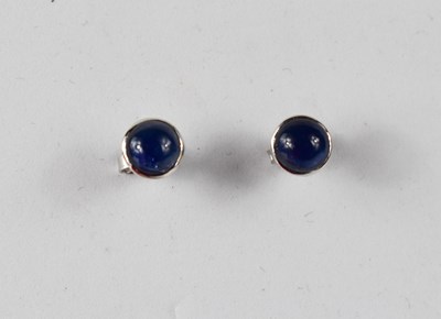 Lot 148 - A 9ct white gold cabochon sapphire stud earrings.