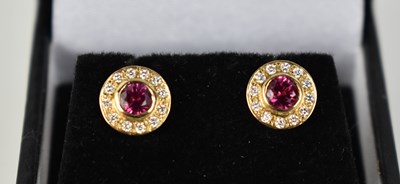 Lot 163 - An 18ct gold ruby and diamond stud earrings.