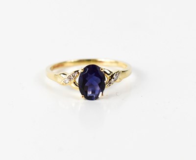 Lot 54 - A 9ct gold, iolite and diamond ring, the oval...