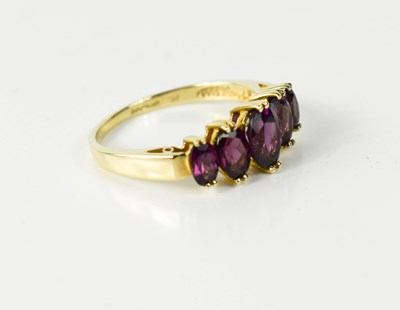 Lot 45 - A 9ct gold and amethyst ring, with five...