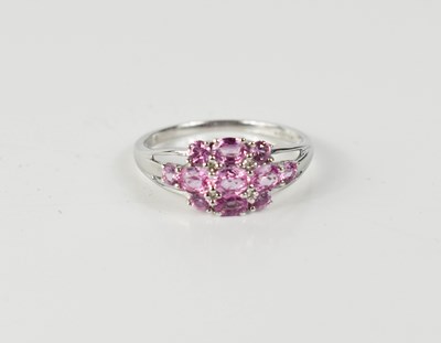 Lot 38 - A 9ct white gold, pink sapphire and diamond...