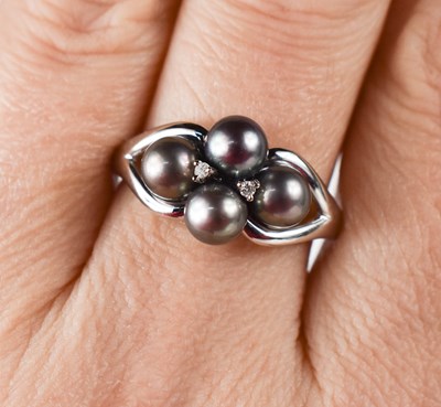 Lot 44 - A 9ct white gold, grey pearl and diamond ring,...
