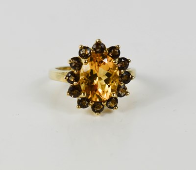 Lot 53 - A 9ct gold, yellow and smokey citrine ring of...