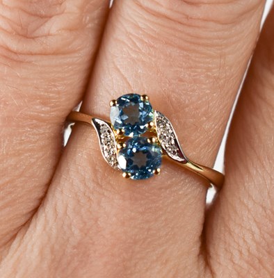 Lot 40 - A 9ct gold, blue topaz and diamond ring, size S.