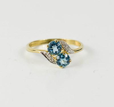 Lot 40 - A 9ct gold, blue topaz and diamond ring, size S.