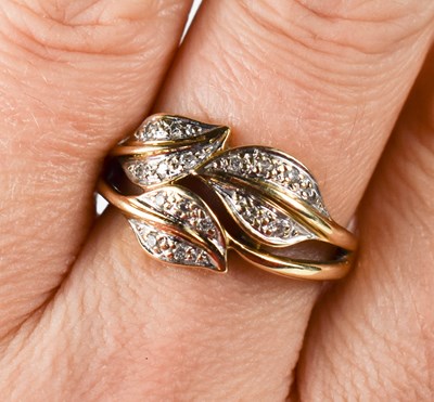 Lot 41 - A 9ct gold and diamond leaf design ring, size...