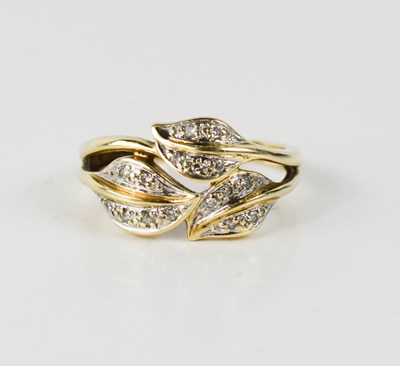 Lot 41 - A 9ct gold and diamond leaf design ring, size...