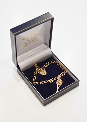Lot 115 - A 9ct gold charm bracelet with a charm in the...