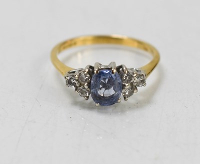 Lot 147 - An 18ct gold, sapphire and diamond ring, the...