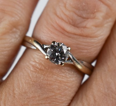 Lot 70 - An 18ct white gold and solitaire diamond ring,...