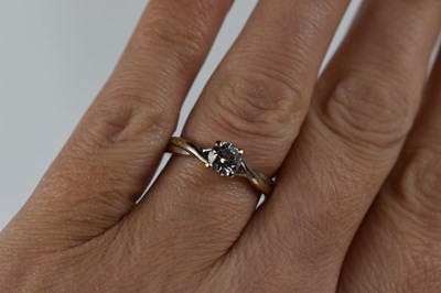 Lot 70 - An 18ct white gold and solitaire diamond ring,...