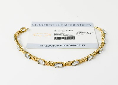 Lot 134 - A 9ct gold and aquamarine bracelet, of celtic...