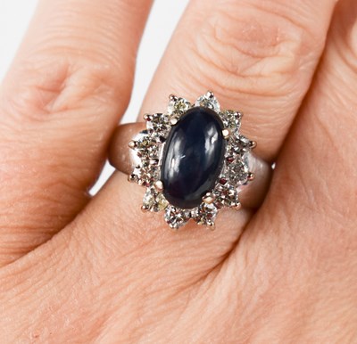 Lot 73 - An 18ct white gold, star sapphire and diamond...