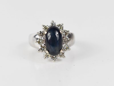Lot 73 - An 18ct white gold, star sapphire and diamond...