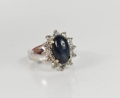 Lot 73 - An 18ct white gold, star sapphire and diamond...