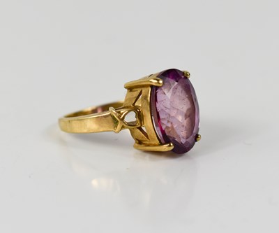 Lot 13 - A 9ct gold and pink sapphire dress ring, the...