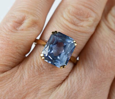 Lot 24 - A 9ct gold and aquamarine dress ring, the...
