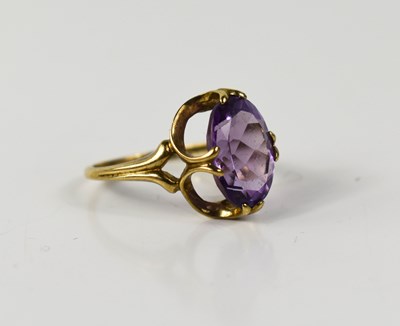Lot 16 - A 9ct gold and amethyst dress ring, the oval...