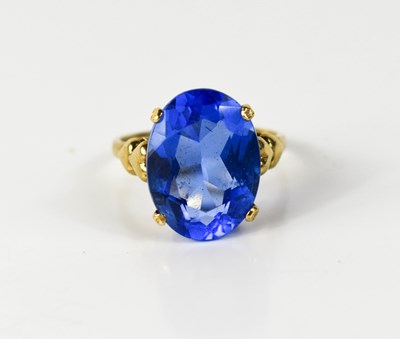 Lot 18 - A 9ct gold and blue topaz dress ring, the oval...