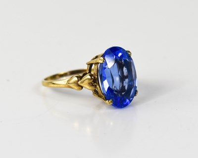 Lot 18 - A 9ct gold and blue topaz dress ring, the oval...