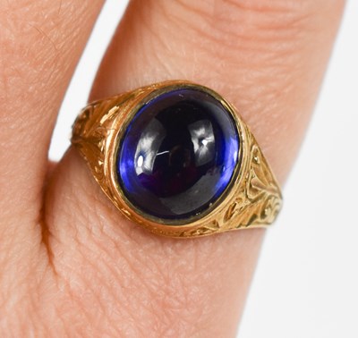 Lot 92 - A 9ct gold and blue stone ring, the cabouchon...