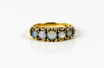 Lot 100 - A 9ct gold and opal five stone dress ring with...