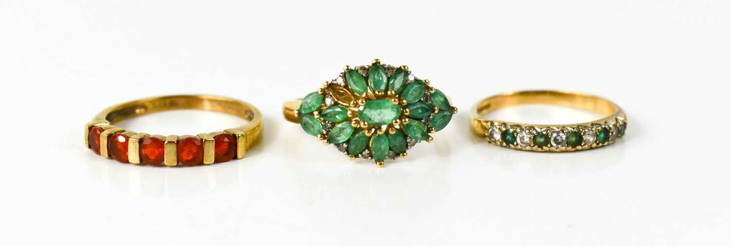 Lot 28 - An Indian 10ct gold and emerald dress ring set...