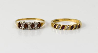 Lot 97 - A 9ct gold ruby and white seven stone ring,...