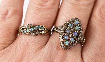 Lot 103 - A 9ct gold opal and diamond dress ring, the...