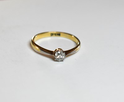 Lot 25 - An 18ct gold, and diamond solitaire ring, set...