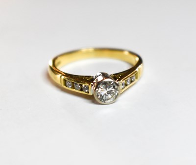 Lot 58 - An 18ct gold and diamond ring, the centre...