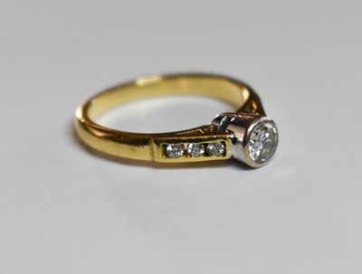 Lot 58 - An 18ct gold and diamond ring, the centre...