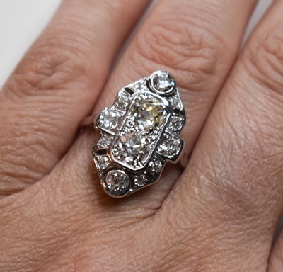 Lot 65 - An Art Deco platinum and diamond ring, with...