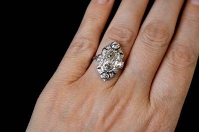 Lot 65 - An Art Deco platinum and diamond ring, with...