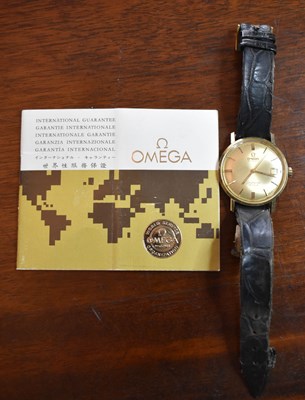 Lot 274 - An Omega gold Seamaster Date Adjust wristwatch,...