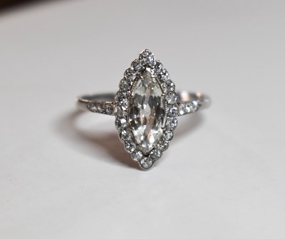 Lot 79 - A platinum and diamond ring, the marquise cut...