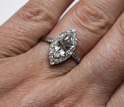 Lot 79 - A platinum and diamond ring, the marquise cut...